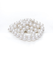 White pearl beads are on white background
