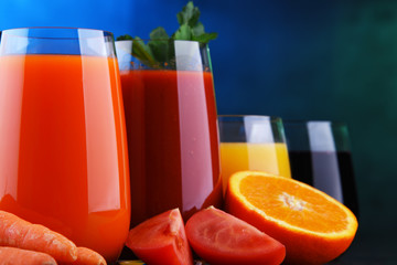 Glasses with fresh organic vegetable and fruit juices