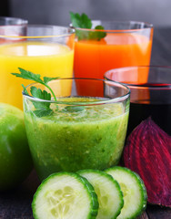 Glasses with fresh organic vegetable and fruit juices