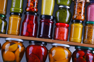 Jars with variety of pickled vegetables and fruits