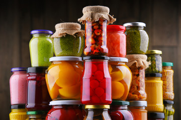 Jars with variety of pickled vegetables and fruits