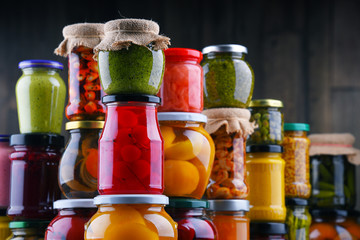 Jars with variety of pickled vegetables and fruits