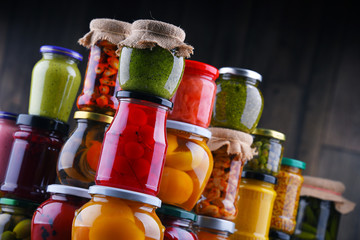 Jars with variety of pickled vegetables and fruits