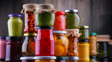 Jars with variety of pickled vegetables and fruits