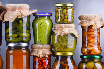 Jars with variety of pickled vegetables and fruits