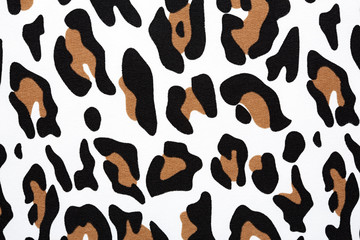Cotton fabric with animal print. Animal pattern background or texture. Texture leopard. Black and white fabric.