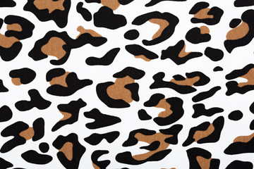 Naklejka na ściany i meble Cotton fabric with animal print. Animal pattern background or texture. Texture leopard. Black and white fabric.