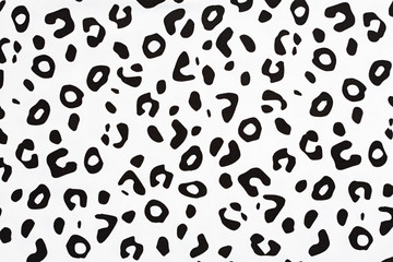 Cotton fabric with animal print. Animal pattern background or texture. Texture leopard. Black and white fabric.