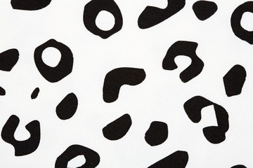 Cotton fabric with animal print. Animal pattern background or texture. Texture leopard. Black and white fabric.