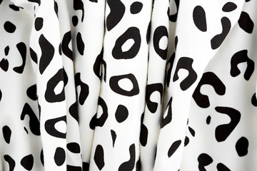 Cotton fabric with animal print. Animal pattern background or texture. Texture leopard. Black and white fabric.