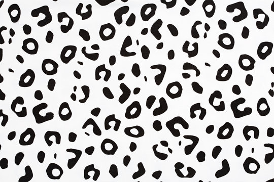 Cotton fabric with animal print. Animal pattern background or texture. Texture leopard. Black and white fabric.