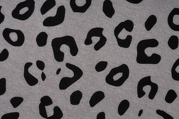 Cotton fabric with animal print. Animal pattern background or texture. Texture leopard.