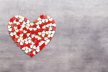 Happy Valentines day background. With small hearts on gray background.