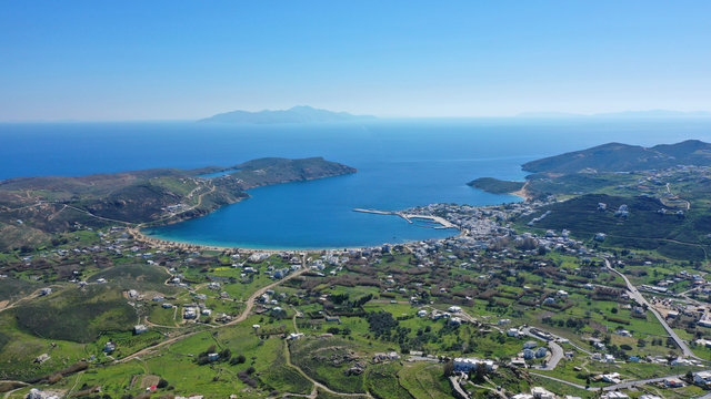 Aerial drone photo of beautiful Livadi beach and main port of Serifos island in spring, Cyclades, Greece