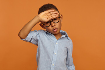 Human facial expressions and body language. Handsome African American male child in round...