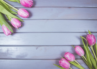 A bouquet of pink tulips with a frame for inscription.