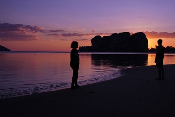 couple on the beach at sunset