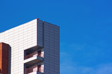 Modern office building on a clear blue sky background
