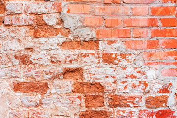 Old vintage red brick wall with sprinkled white plaster texture background.   Horizontal