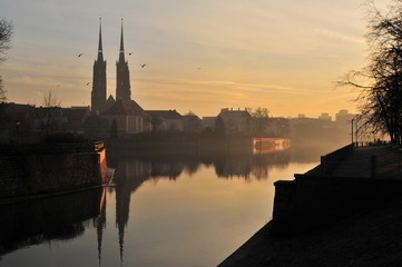 Obraz premium Cathedral of St. John the Baptist twin towers Odra river sunset Wroclaw, Poland, Europe