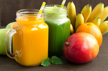 Fresh fruit juice in the jar. on dark background.