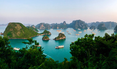 Panorama of a Ha Long Bay with dozens of boats during sunset, Vietnam