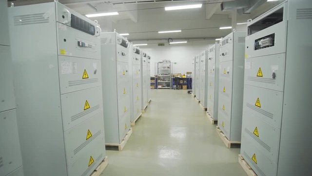 many assembled electrical cabinets stand in a row