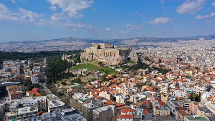 Aerial drone bird's eye view photo of iconic Acropolis hill and the Parthenon a masterpiece of Ancient world, Athens historic centre, Attica, Greece