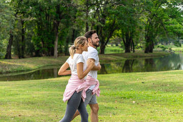 Man and Woman running in the public park