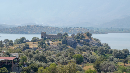 Fototapeta na wymiar Lake of Bafa and old castle ruins