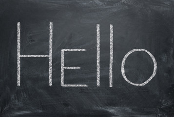 Hello - inscription in chalk on a blackboard. Greeting concept.