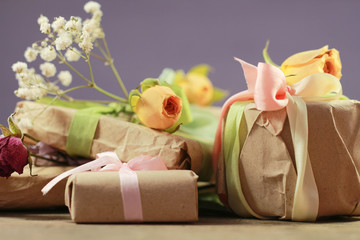 present handmade cosmetics wrapped in papper and flowers