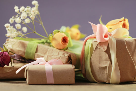 Present Handmade Cosmetics Wrapped In Papper And Flowers