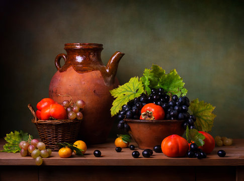 Still life with persimmons and grapes