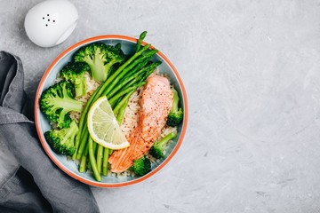 Healthy lunch bowl salmon and broccoli with asparagus and rice