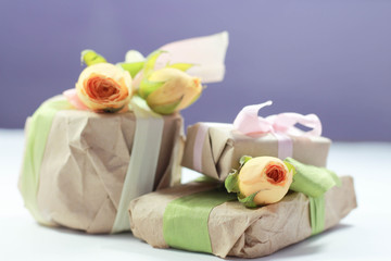 present handmade cosmetics wrapped in papper and flowers