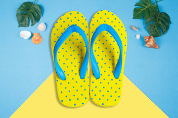 Yellow sandals on blue color background, Summer holidays accessories