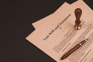 Notary's public pen and stamp on testament and last will. Notary public tools