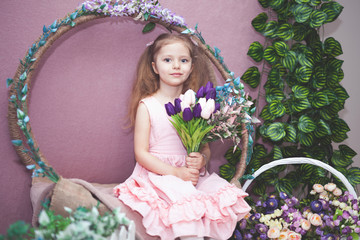 happy womens day for my mom, little girl holds flowers tulip