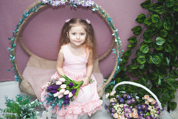 happy womens day for my mom, little girl holds flowers tulip