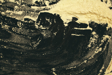 cooking baking. patterns of flour on a black background. rolling pin, flour. cooking dough