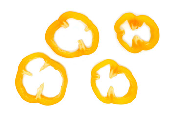yellow bell pepper cut into pieces on white background, top view.