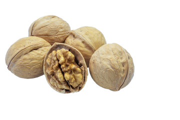 Chopped walnut and whole walnuts on white background