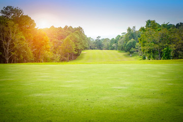 Fototapeta na wymiar The evening golf course has sunlight shining down at golf course in Thailand