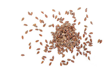 Brown flax seed on white background.