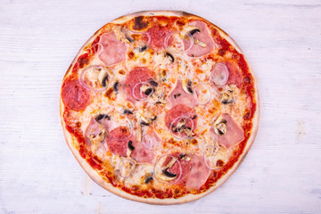 Pizza meat with salami, chicken breast and bacon
