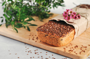Useful home-made vegan sourdough bread from green buckwheat with flax and sunflower seeds. Raw healthy and proper nutrition