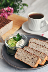 Healthy and proper Breakfast. Sandwich with avocado and homemade bread on sourdough of green buckwheat with flax seeds, sunflower. Raw and vegan food.