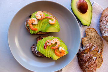 Healthy sandwiches with avocado and shrimp