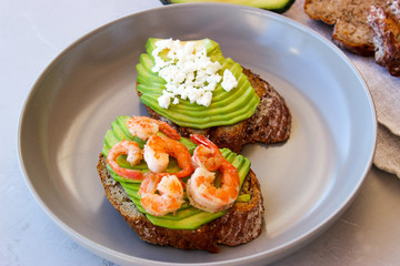 Healthy sandwiches with avocado and shrimp